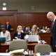 George Zimmerman (right) with defense attorneys Don West and Mark O'Mara (pool/Getty Images)